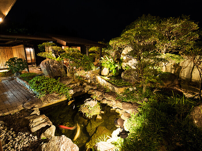 The interior combines Japanese and Ryukyu styles. There's a Japanese garden and waterfall.