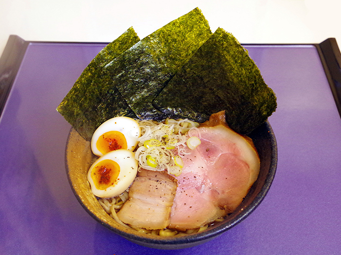 Our best seller， Shimabuta ramen. The soup is made out of local pork， whole chickens， squid and other natural ingredients.
