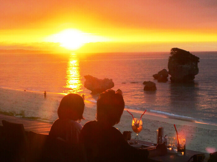 A summer-day miracle. Take in the magnificent vermilion sky during dinner.